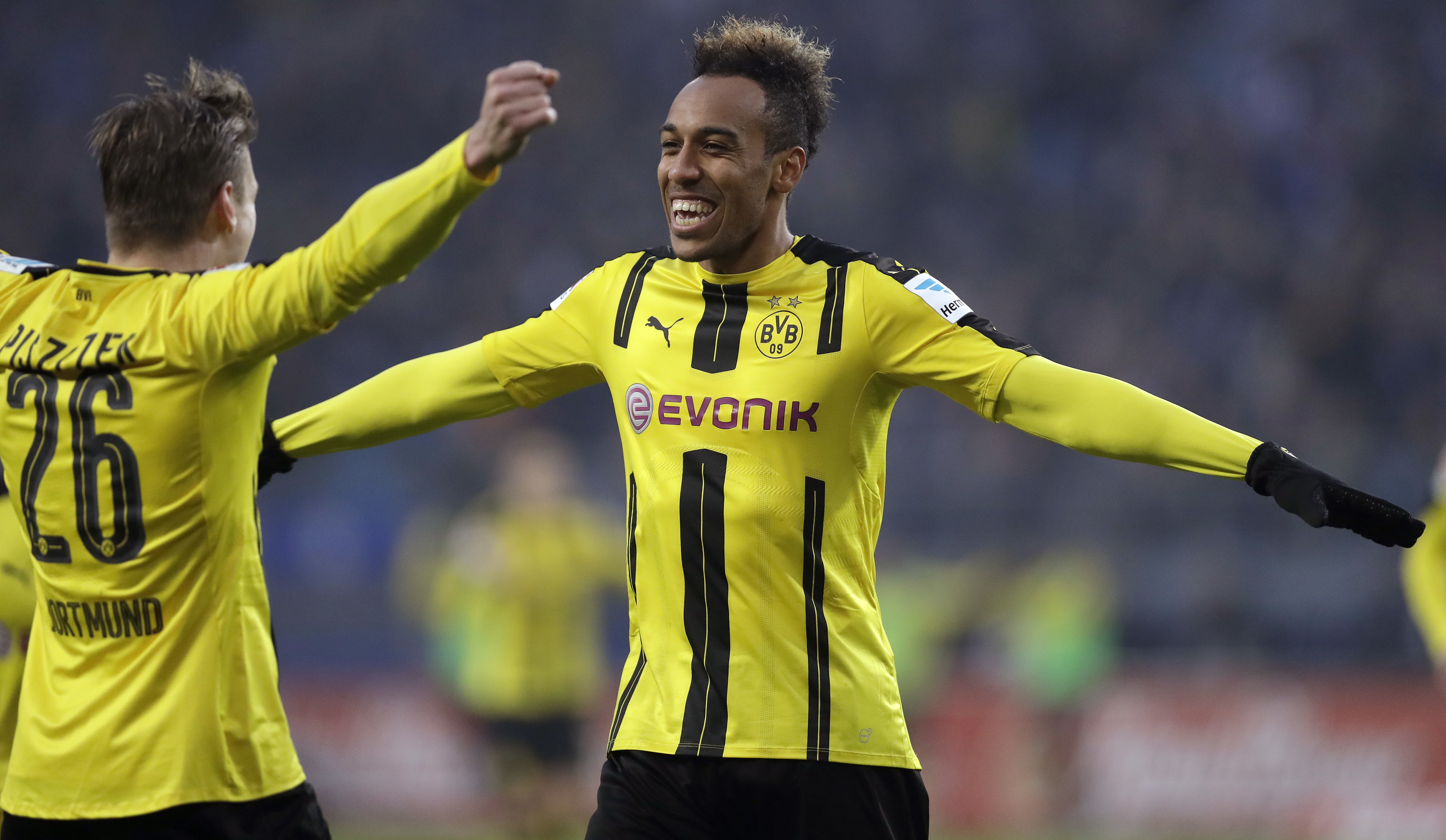 Dortmund's scorer Pierre-Emerick Aubameyang, right, and his teammate Dortmund's Lukasz Piszczek, left, celebrate their side's 4th goal during the German Bundesliga soccer match between Hamburger SV and Borussia Dortmund in Hamburg, Germany, Saturday, Nov. 5, 2016. (AP Photo/Michael Sohn)